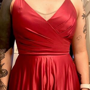 Red dress with pockets and a side slit. little stretch. Worn once.